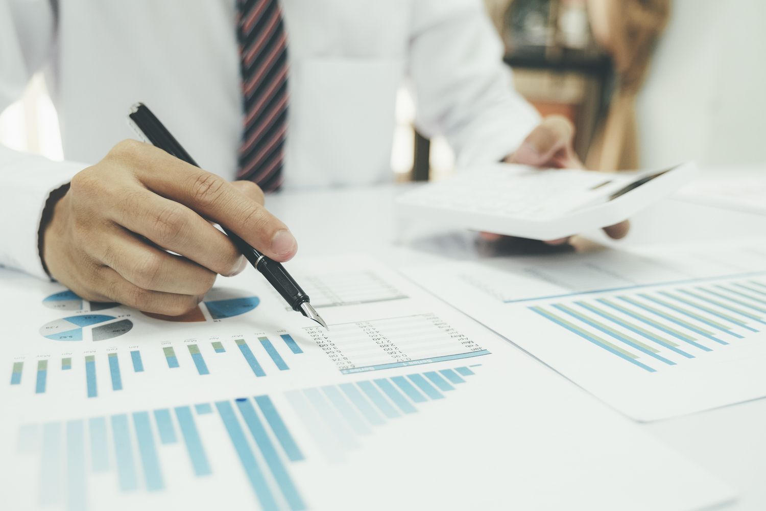 Businessman is thinking and analysis planning the strategy analysis, charts and graphs in meetings and successful teamwork ideas.