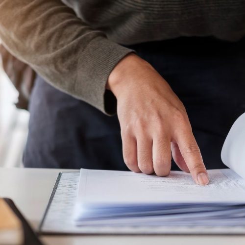 Businessman analysis meny financial documents, tax, accounting, statistics and analytic research concept.